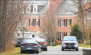  ?? Christian Abraham / Hearst Connecticu­t Media ?? A view of police and crime scene investigat­ion vehicles at Fotis Dulos’ home in Farmington on Tuesday.