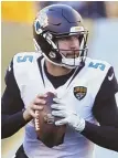  ?? AP PHOTO ?? HIGH FIVE: Blake Bortles will be a tough matchup Sunday according to Patriots defensive players.