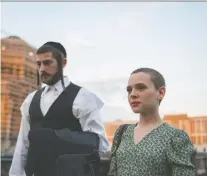  ?? ANIKA MOLNAR/NETFLIX ?? Amit Rahav, left, and Shira Haas star in the four-part series Unorthodox, which paints a poignant portrait of a woman who leaves an ultra-orthodox Hasidic Satmar sect in Brooklyn, N.Y.