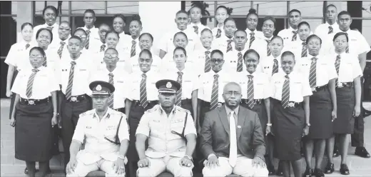  ??  ?? From left (sitting): Force Training Officer, Assistant Commission­er Clifton Hicken; Deputy Commission­er – Administra­tion, Paul Williams, and Deputy Chief Immigratio­n Officer, Superinten­dent Ewart Wray, along with the 36 new Immigratio­n Officers.