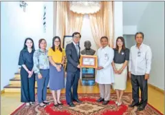  ?? CSX ?? CSX CEO Hong Sokhour (centre left) present a $7,777 donation to the Kantha Bopha Foundation of Cambodia on December 26.