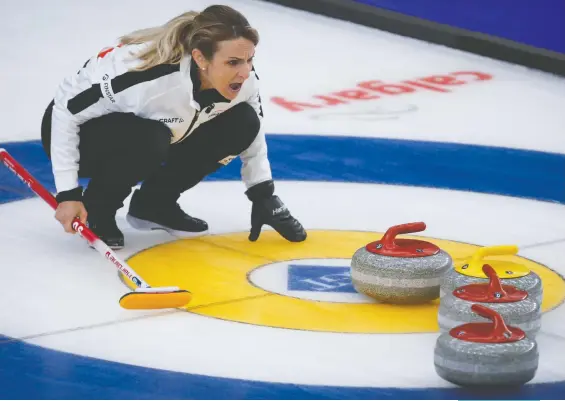  ?? JEFF MCINTOSH/THE CANADIAN PRESS VIA AP ?? Swiss skip Silvana Tirinzoni directs her teammates against Russia in the final at the women's world curling championsh­ip in Calgary on Sunday. The Swiss rink won 4-2 to take its second straight title and sixth for the country in the past nine years.