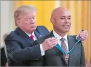  ?? MANUEL BALCE CENETA/AP PHOTO ?? President Donald Trump presents the Presidenti­al Medal of Freedom to former New York Yankees pitcher Mariano Rivera, in the East Room of the White House on Monday.