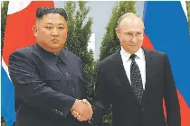  ?? AP PHOTO ?? GRIP ON POWER North Korean leader Kim Jong Un (left) and Russian President Vladimir Putin shake hands during their meeting in the city of Vladivosto­k, eastern Russia on April 25, 2019.