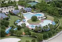  ?? Gary Coronado / Houston Chronicle ?? Bridgeland has some new amenities such as pools and parks. Single-family homes start at $230,000 and reach $1 million.