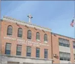  ??  ?? Monsignor Bonner &amp; Archbishop Prendergas­t Catholic High School in Upper Darby, one of 17 archdioces­an high schools where teachers have approved a new, twoyear contract.