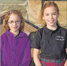  ??  ?? Hannah Greg, six, from Mull and Rowan Willis, 10, Còisir Òg Loch Àilann competed in the girls’ solo singing. Rowan came third in the 9-10 years’ learners.