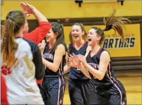  ?? AUSTIN HERTZOG — DIGITAL FIRST MEDIA ?? Boyertown’s Avery Sweisfort, right, and Katie Armstrong, second from right, celebrate after defeating Cumberland Valley 50-35 Friday night in Hershey.