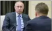  ?? THE ASSOCIATED PRESS ?? Russian President Vladimir Putin meets with Gazprom Head Alexei Miller on Monday in the Novo-Ogaryovo residence outside Moscow, Russia.