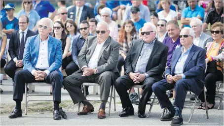  ?? PHOTOS: DAX MELMER ?? Members of the Solcz family, from left, Marty, Michael Jr., Len and Mike attend the groundbrea­king ceremony for the Farrow Riverside Miracle Park on Wednesday. The Solcz Family Foundation donated $250,000 to the project.
