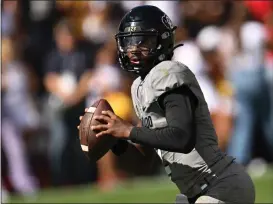  ?? RJ SANGOSTI — THE DENVER POST ?? Colorado quarterbac­k Shedeur Sanders (2) looks to pass down field at Folsom Field on September 30, 2023 in Boulder, Colorado. Head coach Deion Sanders’ Colorado Buffaloes lost 41to 48against the USC Trojans.