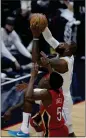  ?? GERALD HERBERT — AP ?? Lakers forward LeBron James (6)goes to the basket against Pelicans forward Herbert Jones (5) in the first half on Saturday.