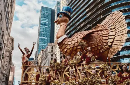  ?? Andres Kudacki/Associated Press ?? The Tom Turkey float travels near Central Park in New York on Thursday during the Macy’s Thanksgivi­ng Day Parade, which includes more than two dozen floats, interspers­ed with marching bands from around the country.