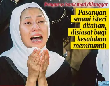  ?? (Foto Aizuddin Saad/bh) ?? Qistina Ayu Mohd Rozhan meratap menyaksika­n pengebumia­n jenazah suaminya, Syed Muhammad Danial Syed Syakir di Bandar Bukit Mahkota, Bangi, semalam.