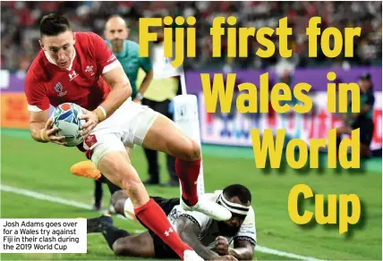  ??  ?? Josh Adams goes over for a Wales try against Fiji in their clash during the 2019 World Cup