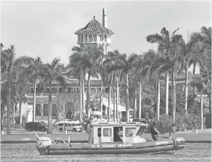  ?? JOE RAEDLE/GETTY IMAGES ?? A U.S. Coast Guard boat passes in front of the Mar-a-Lago Resort where President Donald Trump stays occasional­ly on weekends.