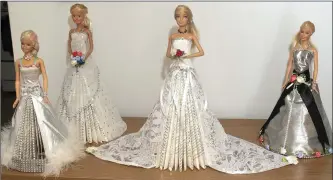  ??  ?? An exquisitel­y dressed bridal Barbie.