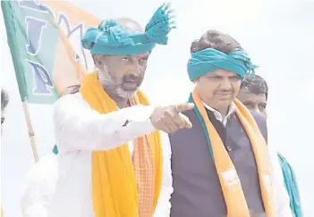  ?? — DC ?? State BJP chief Bandi Sanjay addressing a public meeting along with former Maharashtr­a Chief Minister Devendra Fadnavis as part of the Praja Sangrama Yatra in Vikarabad on Saturday.