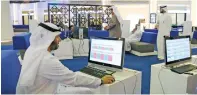  ?? — Reuters ?? Investors are seen at the Dubai Financial Market. The index climbed seventh straight session as Emirates NBD and Union Properties led the positive sentiment in the market.