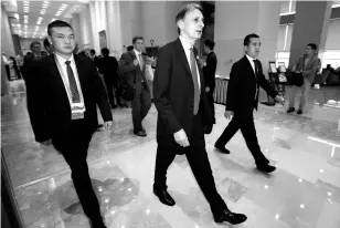  ?? REUTERS ?? Britain’s Chancellor of the Exchequer Philip Hammond (centre) walks to a meeting during the G20 finance ministers and central bank governors conference in Chengdu, China