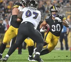  ?? Peter Diana/Post-Gazette ?? James Conner struggled to find room to run against the Ravens defense in Sunday night’s loss.