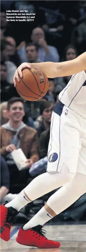  ??  ?? Luka Doncic and the Mavericks are too much for Spencer Dinwiddie (r.) and the Nets to handle. GETTY