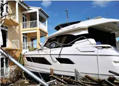  ??  ?? Winds that reached speeds of up to 225mph blew boats on to the shore, left, and left many residents on the island of Abaco homeless, right