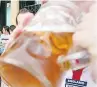  ??  ?? BOOST Footie fans sink beer