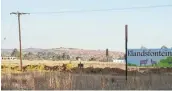  ?? THOMSON REUTERS FOUNDATION / KIM HARRISBERG Pictures: ?? ‘CALLING CARD’: A sign displays the name Elandsfont­ein, a site for recent land occupation­s in the Midvaal region of South Africa.