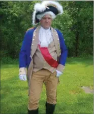  ?? KEITH REYNOLDS — THE MORNING JOURNAL ?? A man who would only identify himself as George Washington poses briefly while awaiting the commenceme­nt of the Kipton Camden Henrietta Memorial Day Parade on May 27 in Kipton.
