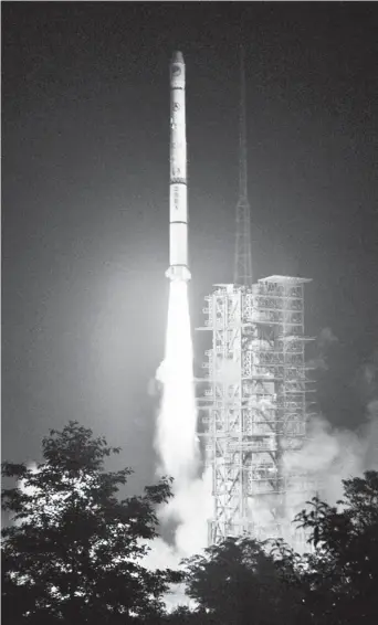  ??  ?? Above: A Long March-3A carrier rocket carrying the 32nd Beidou navigation satellite lifts off from the launch pad in Xichang, Sichuan Province. — IC