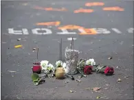  ?? LOGAN R. CYRUS / NEW YORK TIMES ?? Flowers and incense are left in the parking lot where Keith Lamont Scott was fatally shot by police on Sept. 21 in Charlotte, N.C. Police have said officer Brentley Vinson, 26, shot Scott after Scott refused to drop a pistol as he exited a parked...