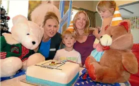  ??  ?? From left; Ronald McDonald house chief executive Mandy Kennedy with Hudson, 5, Ivy, 5, and their mum Nicky Jones celebrate the fifth birthday of the Ronald McDonald house. The Jones family were the first to use the Ronald McDonald House at Southland hospital. JOHN HAWKINS/STUFF