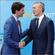  ?? The Associated Press ?? Prime Minister Justin Trudeau, left, is greeted by NATO secretary general Jens Stoltenber­g before a summit of heads of state and government at NATO headquarte­rs in Brussels on Wednesday.