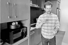  ?? — Reuters photo ?? Daniel Rausch, Amazon’s vice president of Alexa Smart Home, demonstrat­es the company’s new voice-controlled microwave at company headquarte­rs in Seattle, Washington.