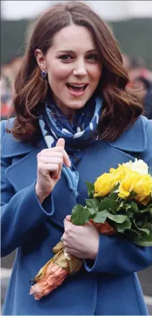  ??  ?? Mixed messages: The Duchess in blue yesterday