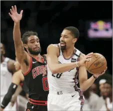  ?? SETH WENIG — THE ASSOCIATED PRESS ?? Brooklyn Nets’ Spencer Dinwiddie, right, looks to pass around Chicago Bulls’ Coby White during the first half.