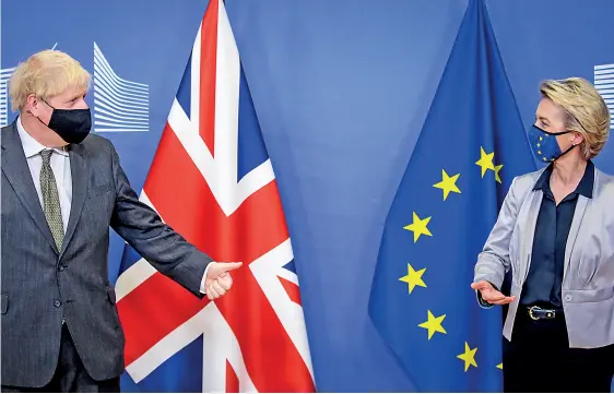  ??  ?? European Commission President Ursula von der Leyen welcomes British Prime Minister Boris Johnson (left) in Brussels, Belgium December 9, 2020. Olivier Hoslet/Pool via REUTERS