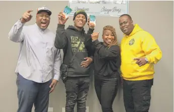  ?? PROVIDED PHOTO ?? The Dovetail Project Founder Sheldon Smith, Lamar Jackson, Tatansha Spencer-Jackson and program director Vernon Owens, celebrate a call from Bears wide receiver Allen Robinson informing them he is sending Jackson and his mother to Super Bowl LIV in Miami.