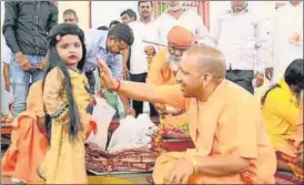  ?? HT PHOTO ?? ■ CM Yogi Adityanath performing ‘Kanya Pujan’ at Gorakhnath Temple in Gorakhpur on Monday.