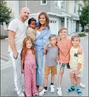  ?? CP HO PHOTO VANESSA VAN TOL ?? Vanessa van Tol and her husband Jordan pose for a photo with their children Malaya, 6, baby Reamohetse, Maverick, 8, Cruz, 10, and Roan, 8, in this undated handout photo. With a family of seven living in a threebedro­om townhouse and a fitness business she runs from home, Vanessa van Tol is a pro at maximizing space.