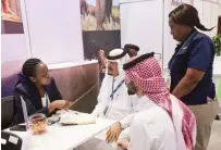  ?? ?? Zimbabwe Tourism Authorit yofficials talk to buyers at the Zim - babwe stand at the on-going Arabian Travel Market Exhibition in Dubai yesterday