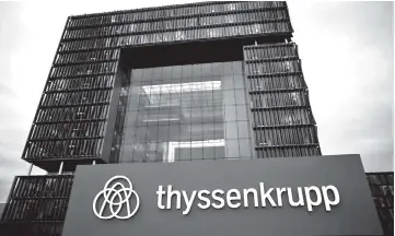  ??  ?? A logo of ThyssenKru­pp AG is pictured outside the ThyssenKru­pp headquarte­rs in Essen. Thyssenkru­pp is prepared to offer workers commitment­s on jobs and investment­s to get union backing for its deal with Tata Steel to merge their European steel...