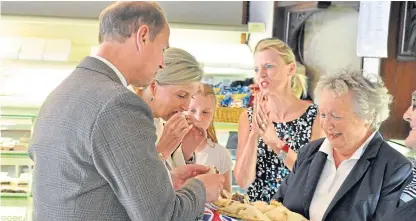  ??  ?? Top: The earl meeting some of those involved with Strathmore Community Rugby Trust. Above: The earl and countess enjoying a bridie with Amelie, Morna, Morag and Sandy Saddler.