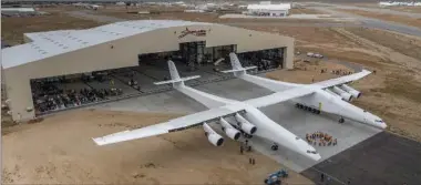  ?? COURTESY OF STRATOLAUN­CH SYSTEMS ?? Paul Allen’s Stratolaun­ch airplane emerges from its hangar in Mojave, Calif., on Wednesday.