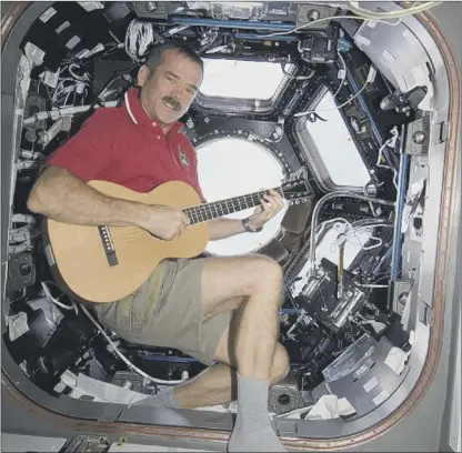  ?? Picture: Nasa ?? Space oddity: astronaut Chris Hadfield plays his version of the Bowie song while in orbit
