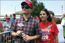  ?? ALAN FRAM — THE ASSOCIATED PRESS ?? Ashley Arentz, 28, of Jacksonvil­le, N.C., waits in line with friend Jonathan Ritter to enter a rally that President Donald Trump staged for Republican congressio­nal candidate Dan Bishop in Fayettevil­le, N.C., Monday. Arentz, a Marine, said she signed up to vote at the rally. Trump’s campaign is on the hunt for political unicorns: Trump’s team is searching for people in battlegrou­nd states who support the president but didn’t vote in 2016.