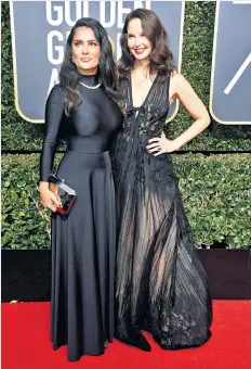  ??  ?? Solidarity: Salma Hayek and Ashley Judd wore black at the Golden Globes in January