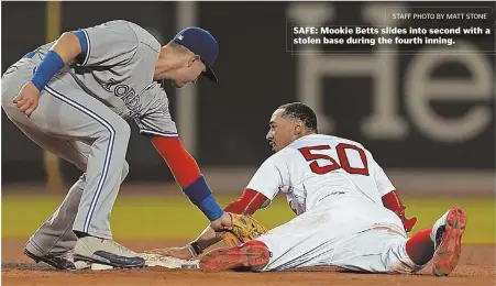  ?? STAFF PHOTO BY MATT STONE ?? SAFE: Mookie Betts slides into second with a stolen base during the fourth inning.