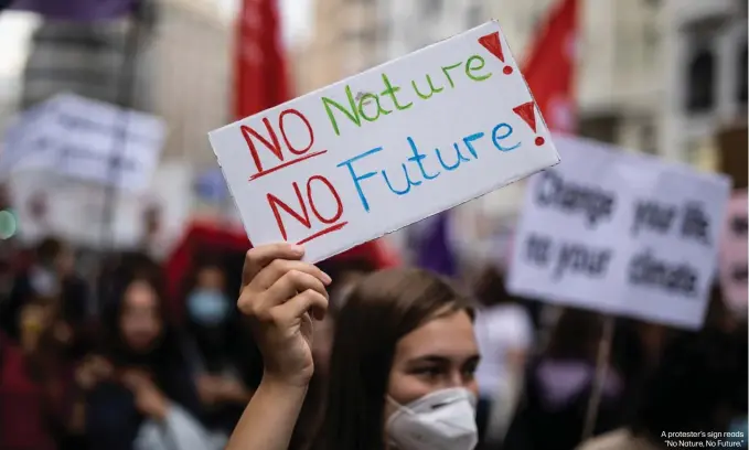  ?? ?? A protester's sign reads “No Nature, No Future.”